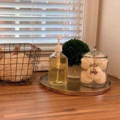 Showing eBun mouthwash dispenser being repurposed as detergent dispenser